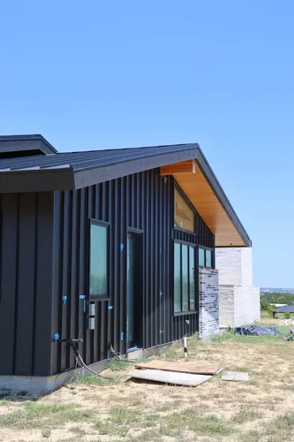 Exterior Black Siding Elevation — custom home by Open Prairie (Build Process · Behind the build)