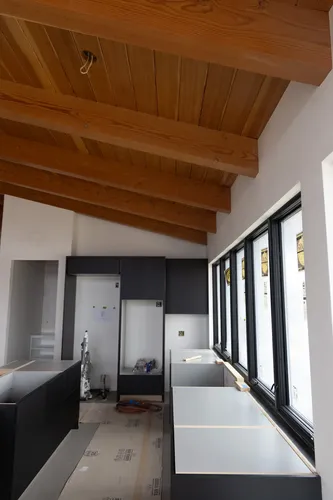 Exterior Black Siding Small Window — custom home by Open Prairie (Build Process · Behind the build)