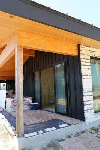 Exterior Patio Sliding Door — custom home by Open Prairie (Build Process · Behind the build)