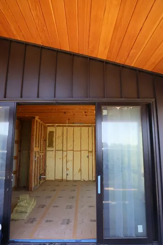 Exterior Sliding Door Insulation — custom home by Open Prairie (Build Process · Behind the build)