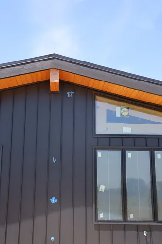 Exterior Stone Chimney Elevation — custom home by Open Prairie (Build Process · Behind the build)