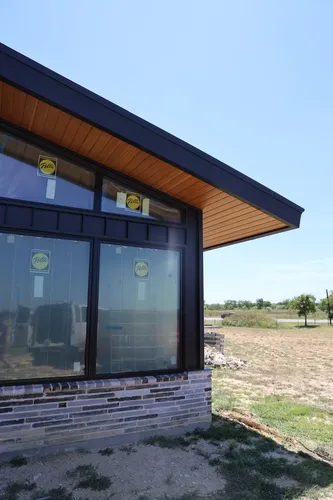 Exterior Window Cedar Soffit — custom home by Open Prairie (Build Process · Behind the build)