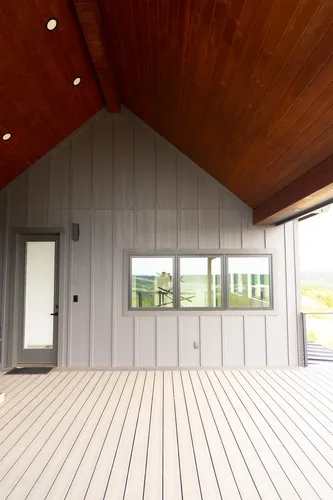 Covered Porch Deck Floor — custom home by Open Prairie (The Barndominium · Graford)