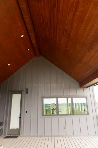 Covered Porch Wood Ceiling — custom home by Open Prairie (The Barndominium · Graford)