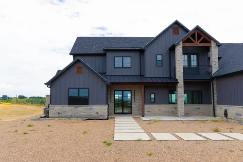 Exterior Front Entry Wide — custom home by Open Prairie (The Barndominium · Graford)