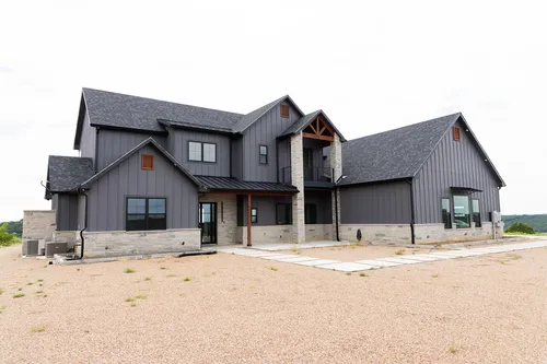 Exterior Front Full Wider — custom home by Open Prairie (The Barndominium · Graford)
