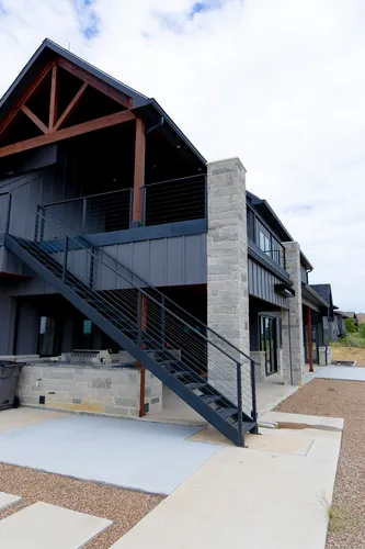 Exterior Side Staircase Angle — custom home by Open Prairie (The Barndominium · Graford)