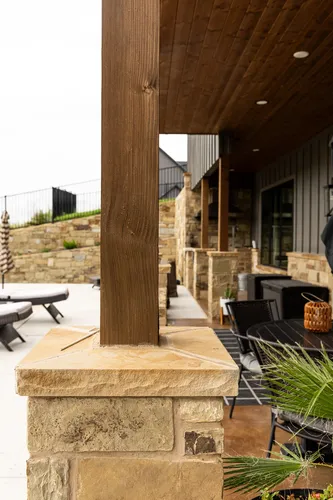 Back Patio Covered Stone Columns — custom home by Open Prairie (The Estate · Graford)