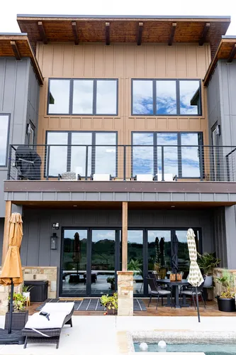 Exterior Rear Pool Balcony — custom home by Open Prairie (The Estate · Graford)