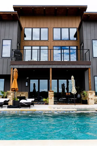 Exterior Rear Pool Wide — custom home by Open Prairie (The Estate · Graford)