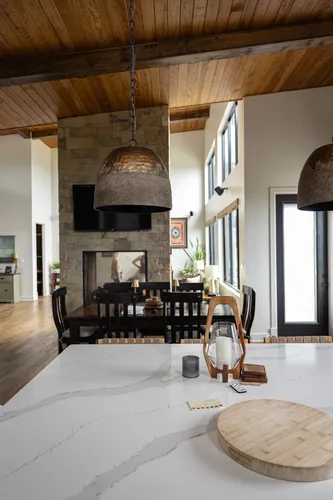 Kitchen Island View To Fireplace — custom home by Open Prairie (The Estate · Graford)