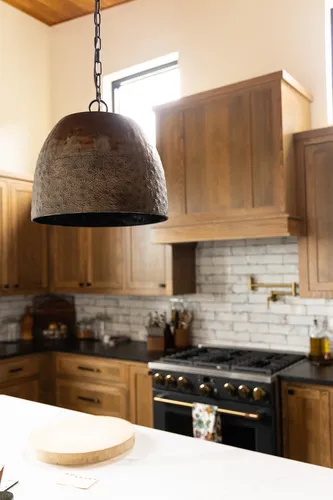Kitchen Pendant Range View — custom home by Open Prairie (The Estate · Graford)