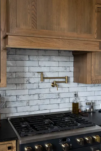 Kitchen Range Backsplash Pot Filler — custom home by Open Prairie (The Estate · Graford)