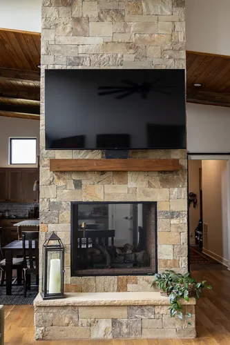 Stone Fireplace Tv Above — custom home by Open Prairie (The Estate · Graford)