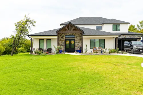 Exterior Front Lawn Wide — custom home by Open Prairie (The Lakehouse · Graford)