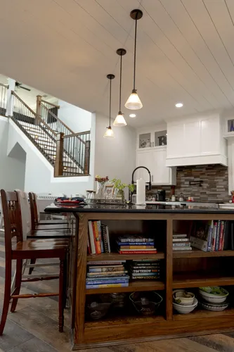Kitchen Island Bookshelf Pendants — custom home by Open Prairie (The Lakehouse · Graford)