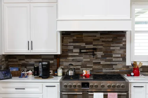 Kitchen Range Stone Backsplash — custom home by Open Prairie (The Lakehouse · Graford)