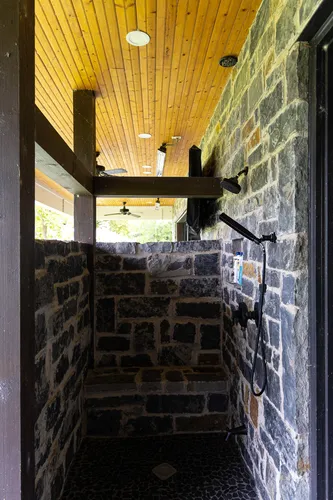 Outdoor Stone Shower — custom home by Open Prairie (The Lakehouse · Graford)