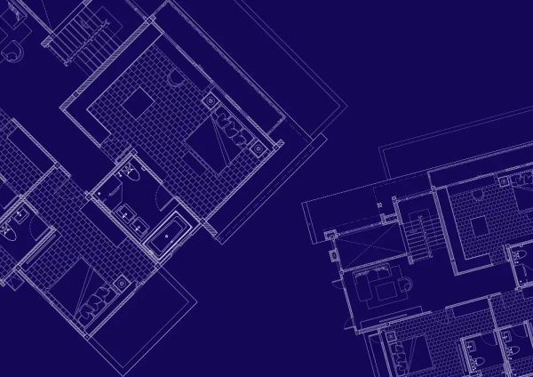 Custom home blueprint and construction plans on a table
