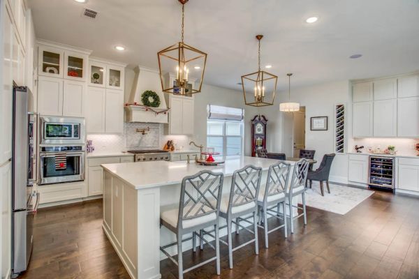 Kitchen island with pendant lighting in a Fort Worth custom residence
