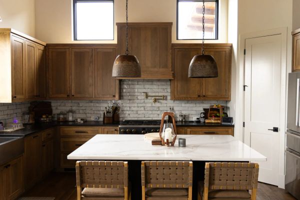 Open kitchen with oversized island in an Open Prairie estate home