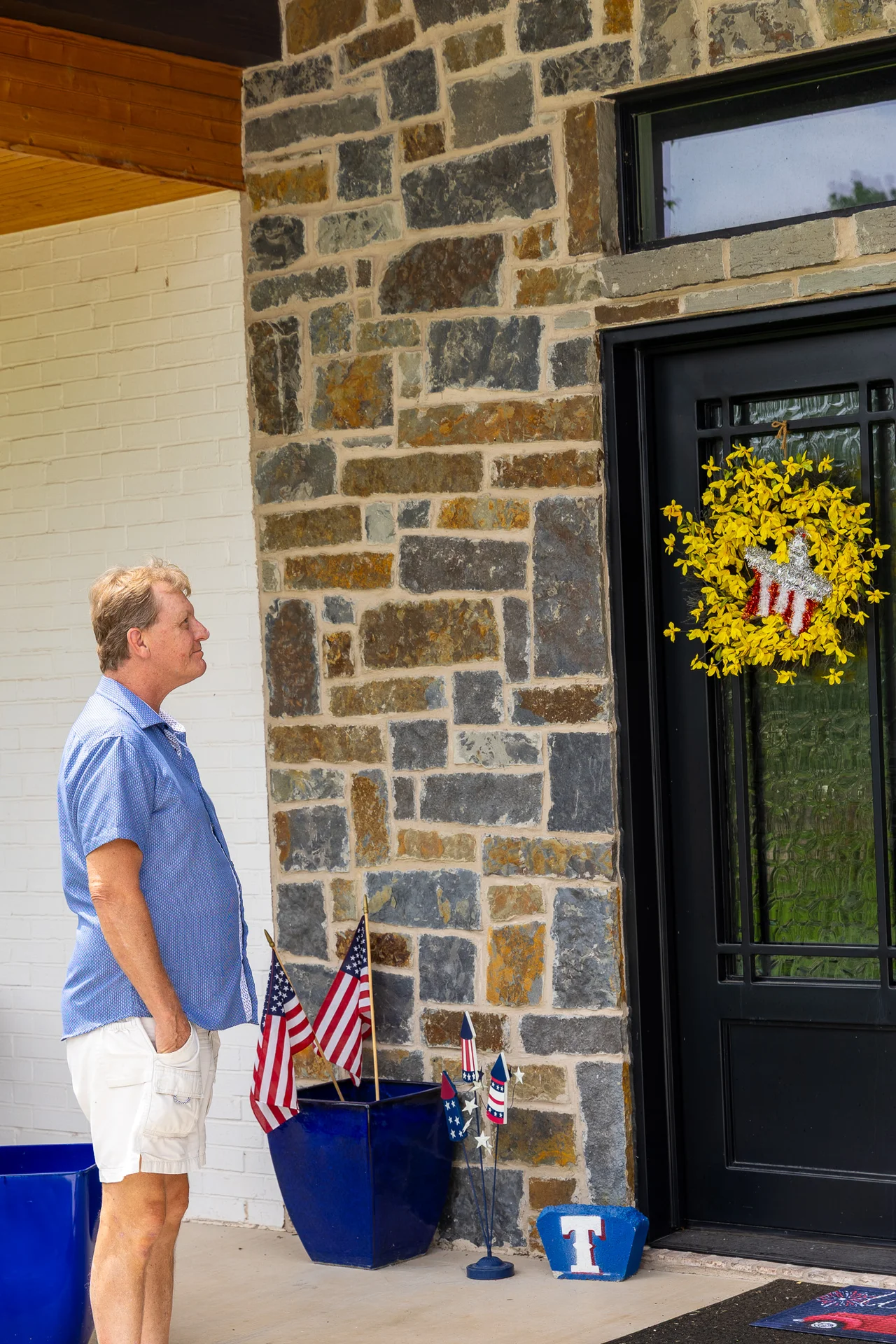 Dan Schlaak, owner of Open Prairie Custom Homes, inspecting stone masonry on a North Texas custom home