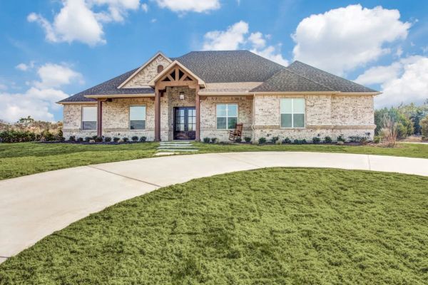 Front entry of a custom Aledo retreat home built by Open Prairie